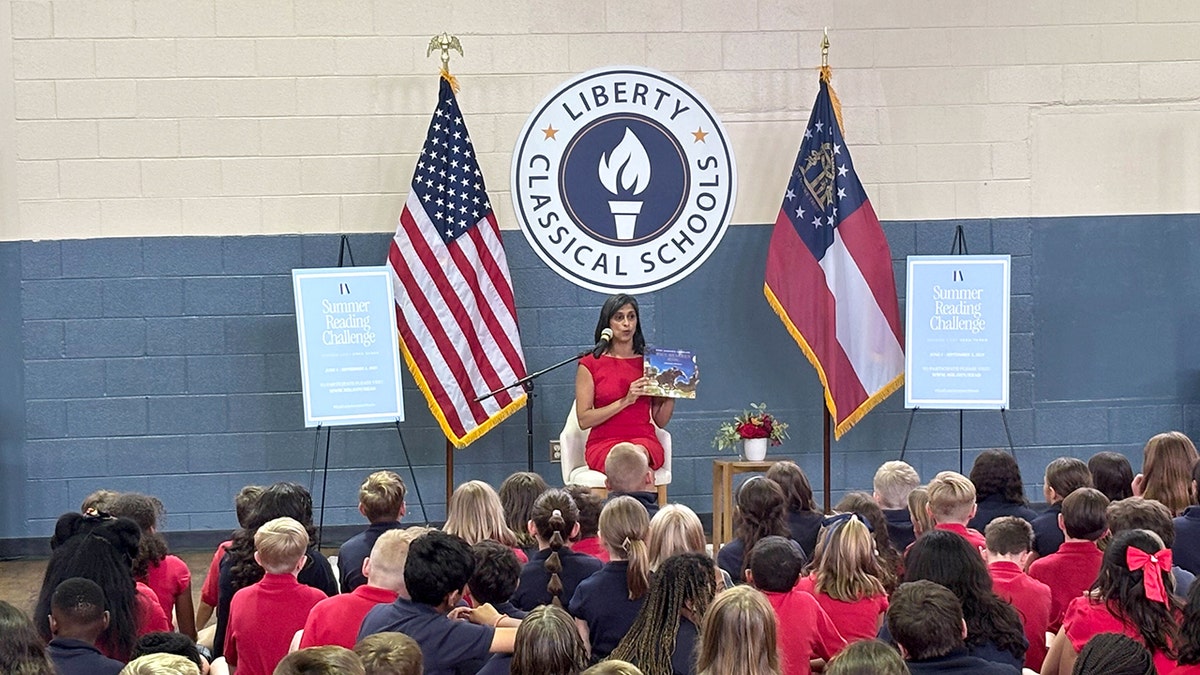 Second Lady Usha Vance reading a book as part of her Summer Reading Challenge.
