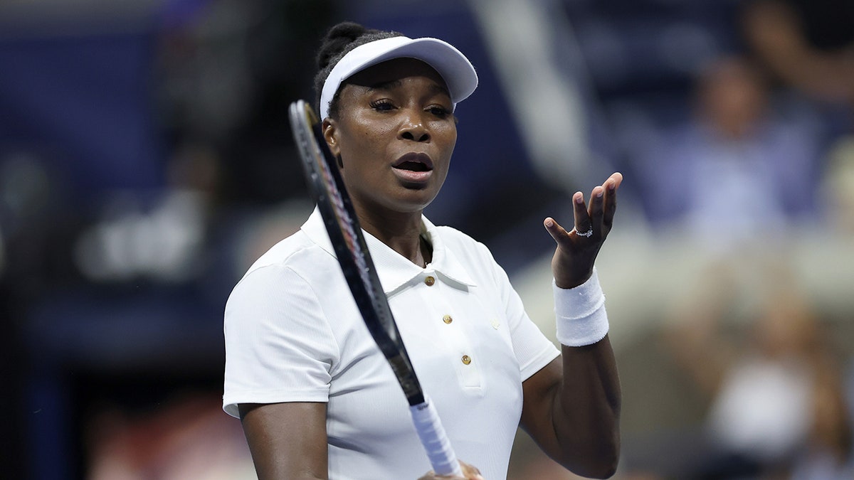 Venus Williams reacts during a tennis match