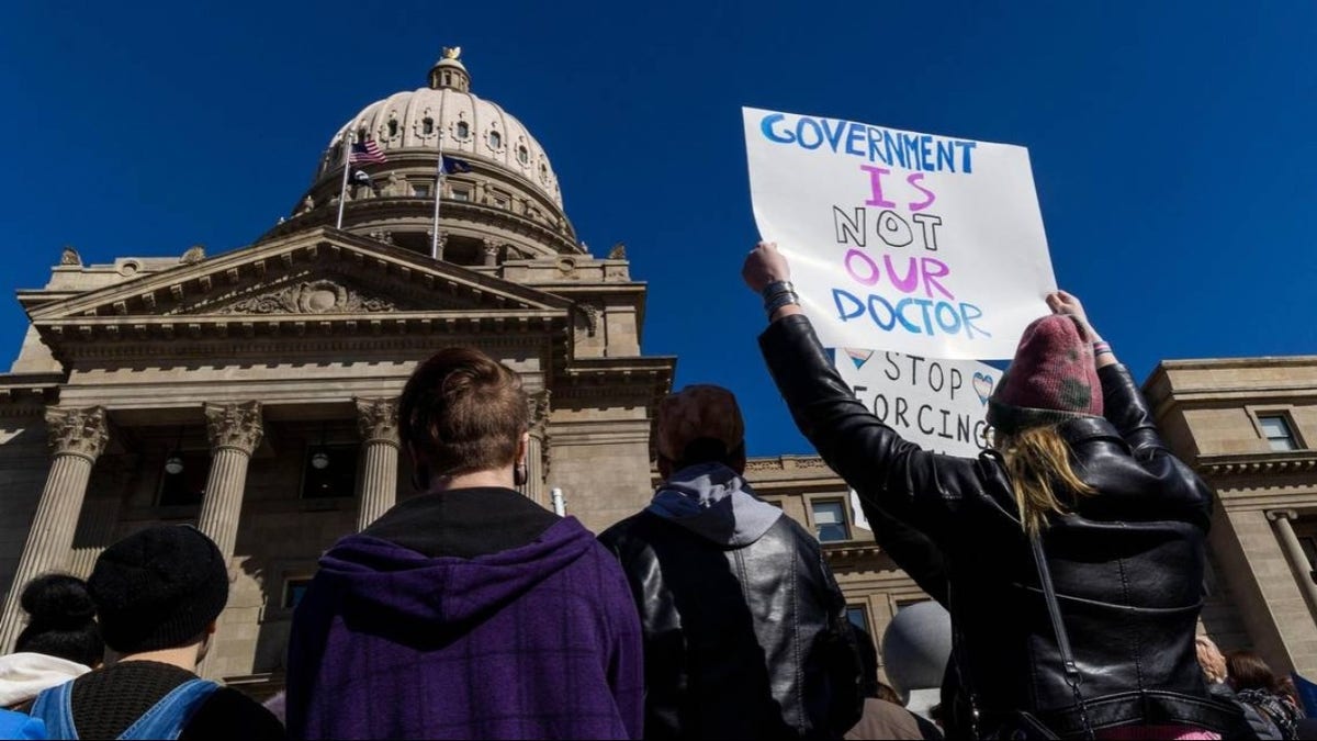 More than 300 people gather in front of the Idaho Capitol to oppose anti-transgender legislation moving through the Legislature in February 2023 in Boise. A federal judge on Thursday paused a new law that restricts which bathrooms transgender students can use in Idaho schools.
