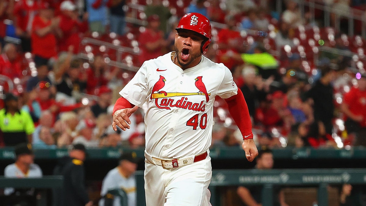 Willson Contreras scores during a game