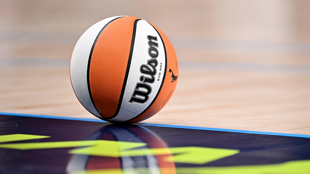 A WNBA basketball on the floor