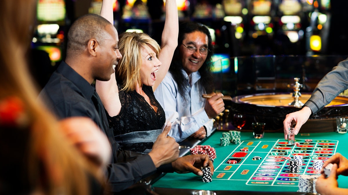 woman-celebrating-casino-win Las Vegas Casino see less gambling between young generations because of the dramatically reduced tourism