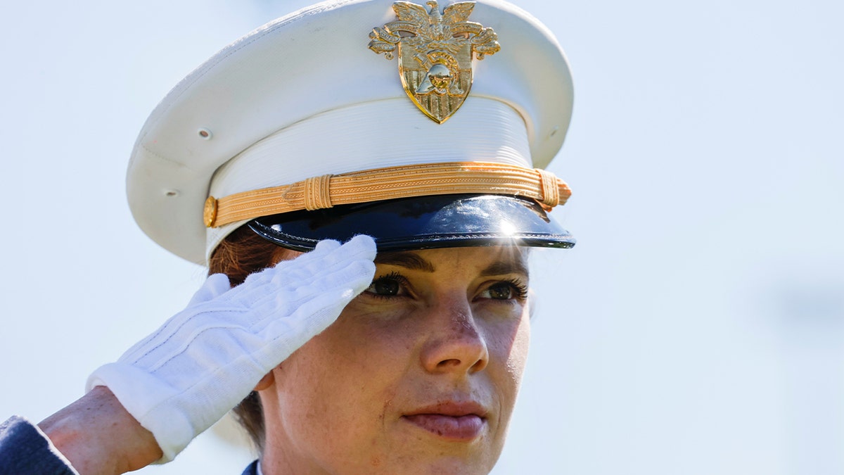Woman salutes at Naval Academy graduation 