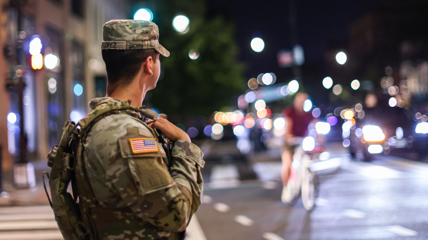 A member of the Ohio National Guard patrols 14th Street in Washington, DC, US, on Saturday, Aug. 23, 2025.