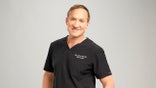 Dr. Terry Dubrow standing in a studio setting