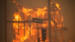 A house burns in the Palisades fire
