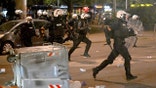 Serbian riot police clashes with anti-government protesters in Belgrade on August 13, 2025. .