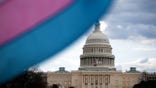 WASHINGTON, DC - MARCH 31: The U.S. Capitol Building is seen behind the Transgender Pride Flag during the Trans Day Of Visibility rally on the National Mall on March 31, 2025 in Washington City. Trans, non-binary, and gender-expansive people and supporters took part in rallies around the country to fight for trans rights and equality on International Transgender Day of Visibility. (Photo by Kayla Bartkowski/Getty Images)