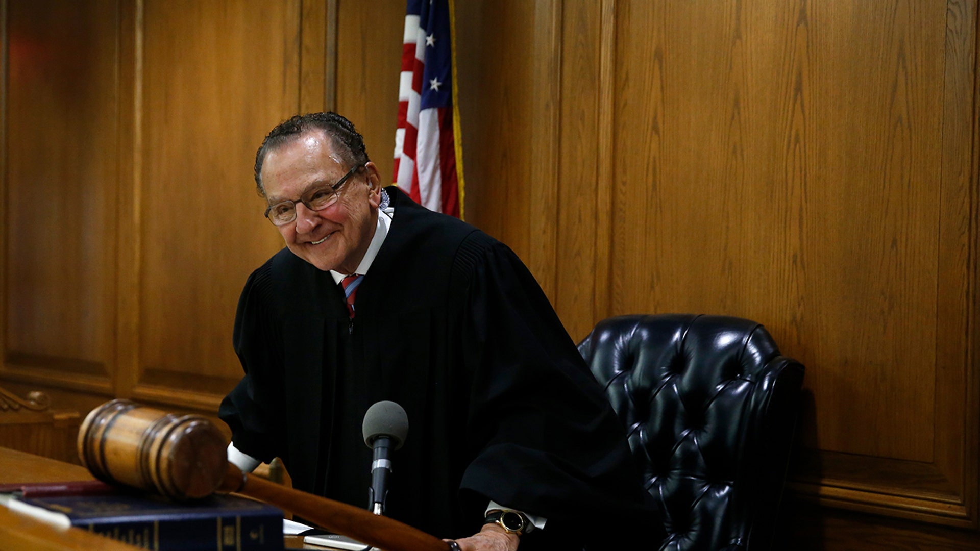 Judge Frank Caprio smiling while inside the Municipal Court in Providence Rhode Island in 2017.