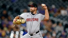 Diamondbacks reliever seals victory over Rockies after swallowing fly mid pitch: 'I gagged a little'
