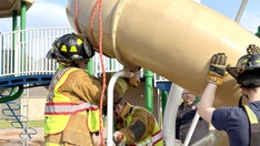 Firefighters cut open playground slide to rescue 40-year-old man stuck inside
