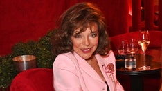 Joan Collins teases her next big career move while sizzling in white swimsuit at 92