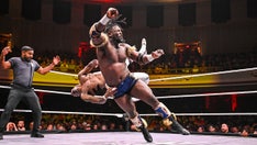 WWE star Oba Femi throws opponent through table from ring during Heatwave match, retains title