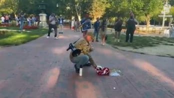 Veteran burns American flag in front of White House on day of controversial Trump executive order
