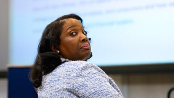 Lawyers for Cook, DOJ trade blows at high-stakes clash over Fed firing