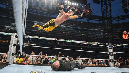 Logan Paul provides highlight reel moment with frog splash onto Jelly Roll through table at SummerSlam
