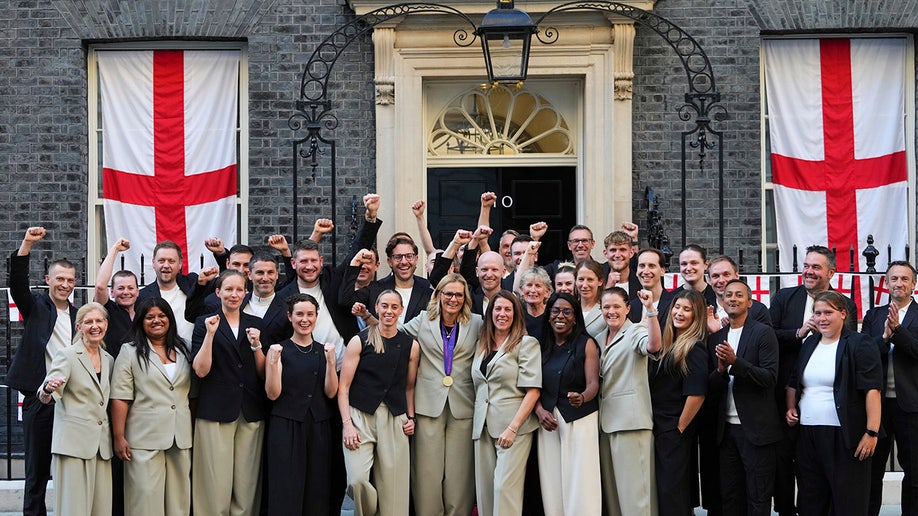 People pose outside for photo
