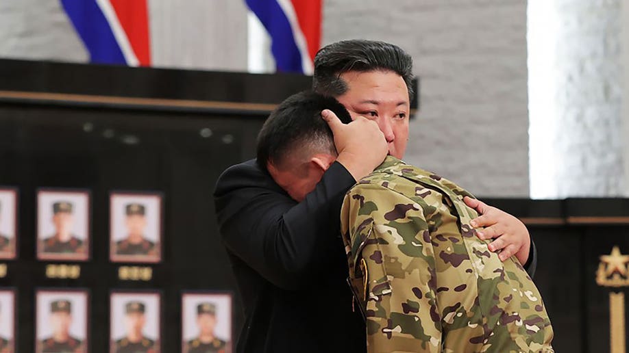Kim hugs soldier who survived war in Kursk