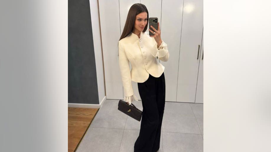 Kseniya Alexandrova taking a mirror selfie