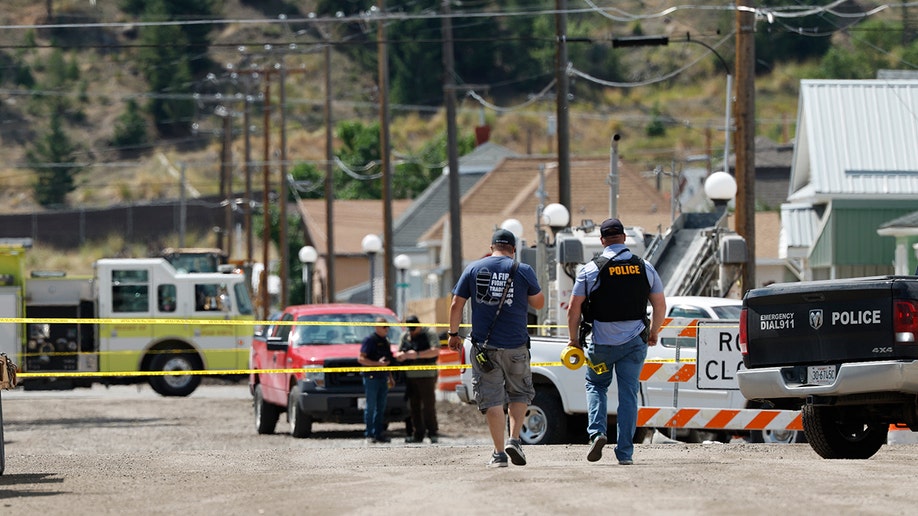 Police and other emergency personnel are seen after a reported shooting in Anaconda, Mont., Friday, Aug. 1, 2025.