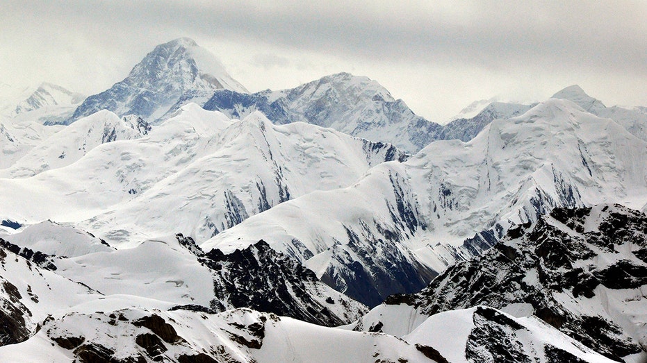 Rescue effort halted for stuck climber on treacherous mountain after climber dies trying to help her: reports