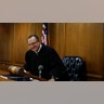 Judge Frank Caprio smiling while inside the Municipal Court in Providence Rhode Island in 2017.