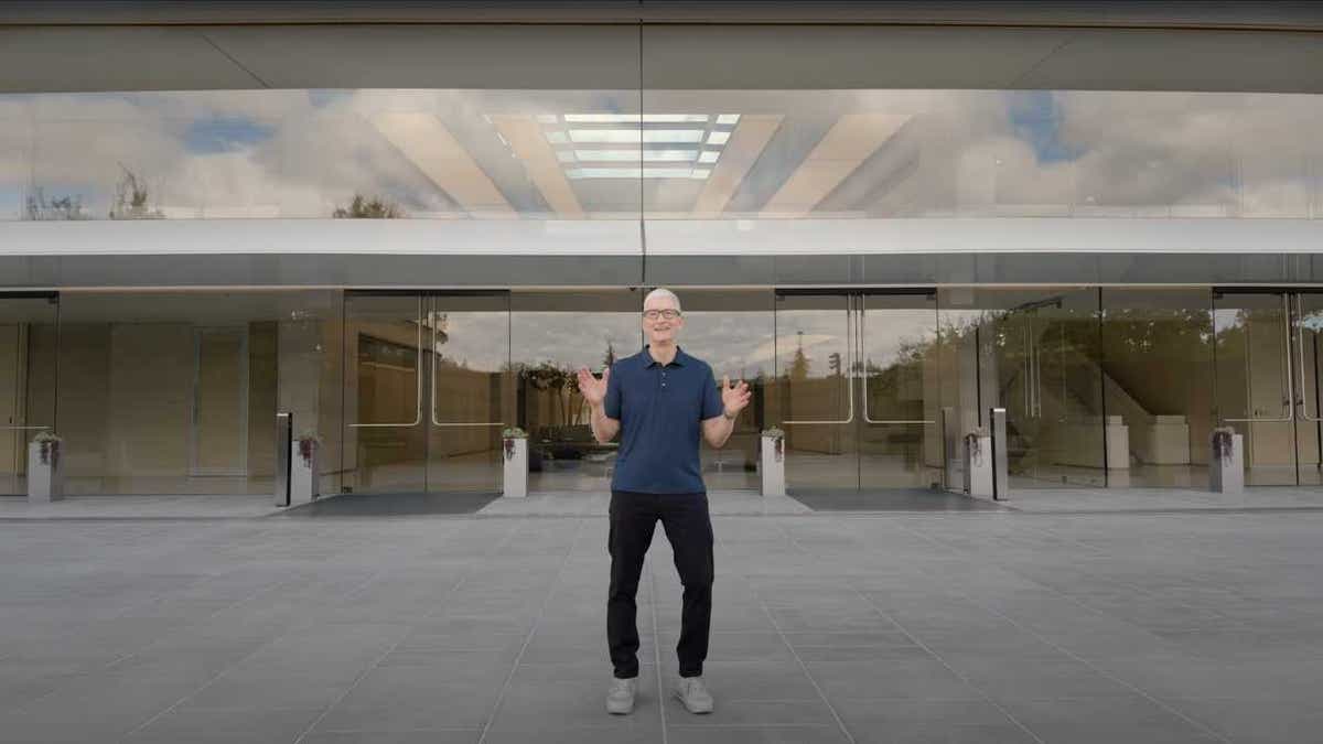 tim cook in front of apple store