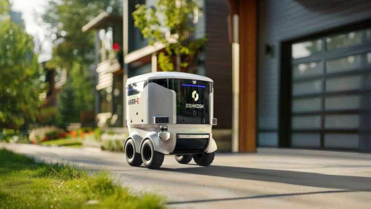 white cube-like rolling robot travelling past apartments