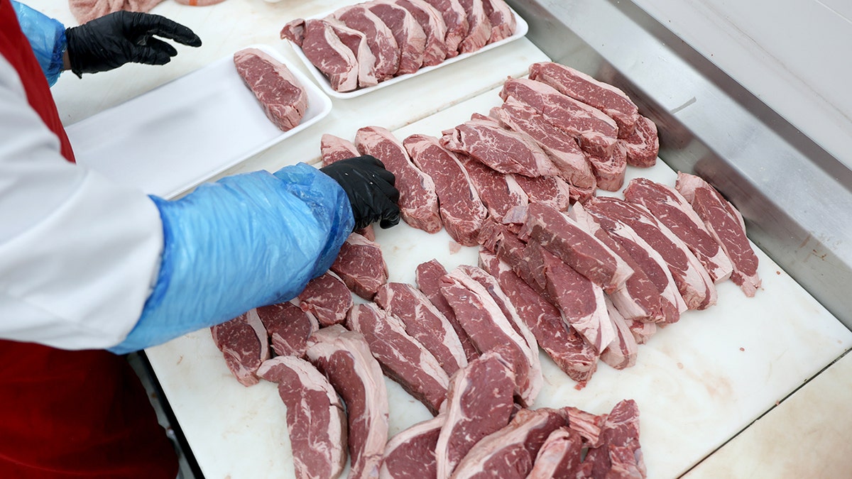 American beef is shown on a slab at a grocery store.