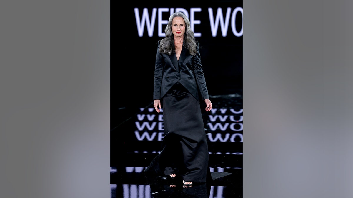 Andie MacDowell walking the runway at the L'Oréal Paris show during Paris Fashion Week in September 2025.