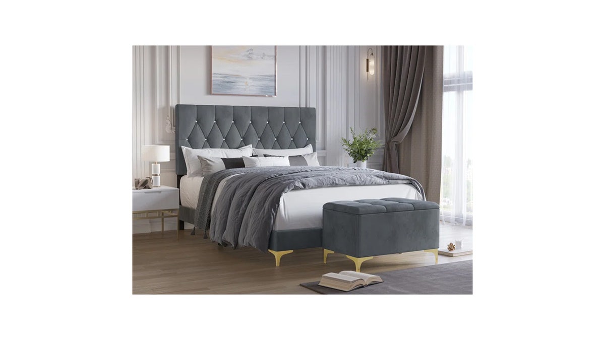 This bedroom set features golden iron legs and a button-tufted headboard. 