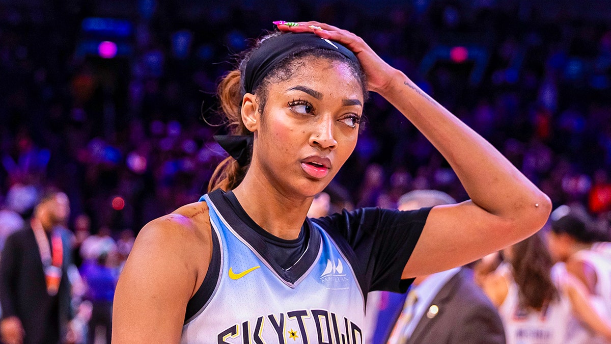 Angel Reese reacts on court