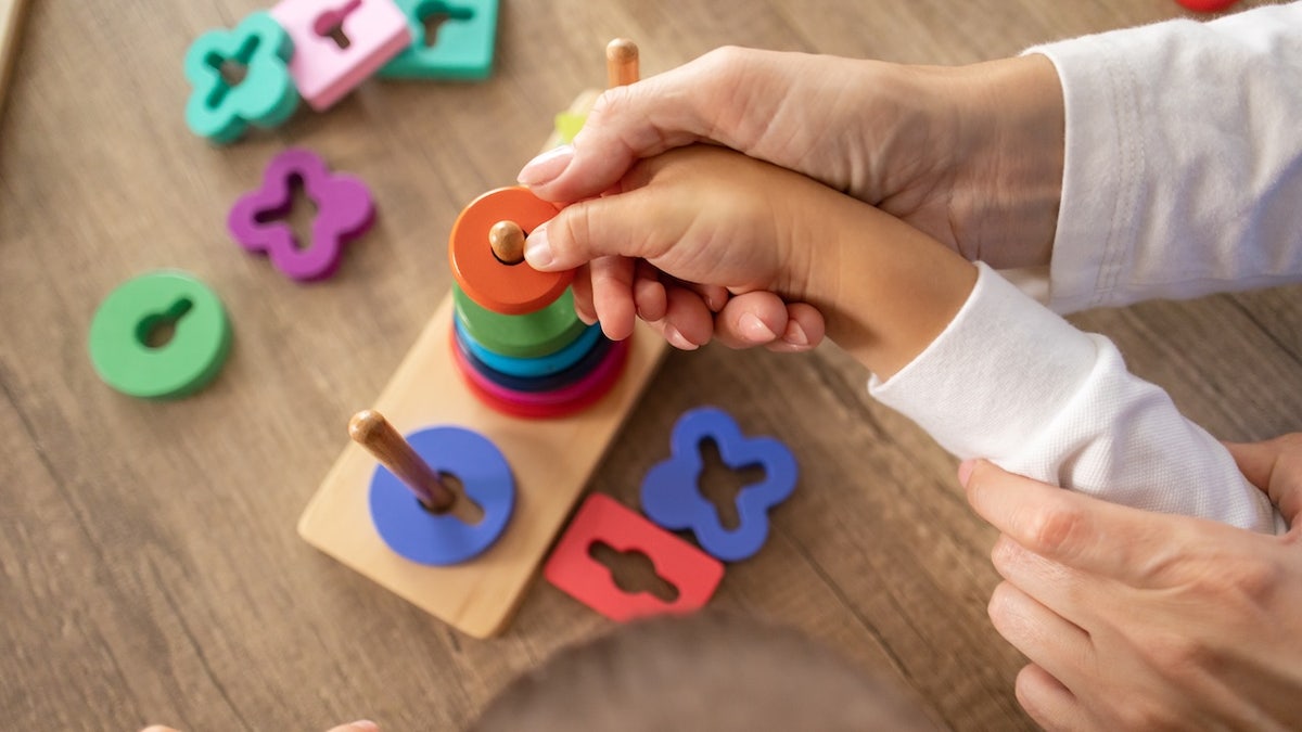 Autistic child playing with toys