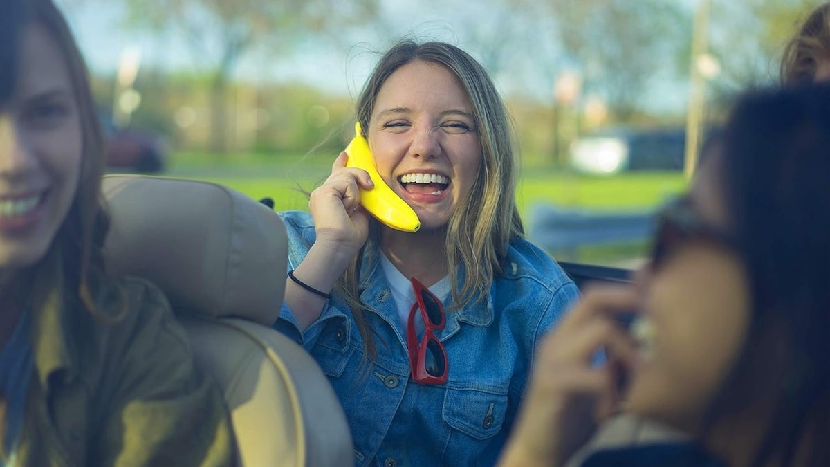 woman using bluetooth banana phone