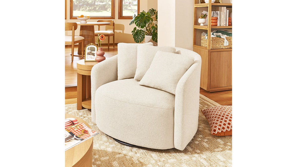 Swivel all the way around in this beautiful, soft accent chair from the Drew Barrymore collection. 