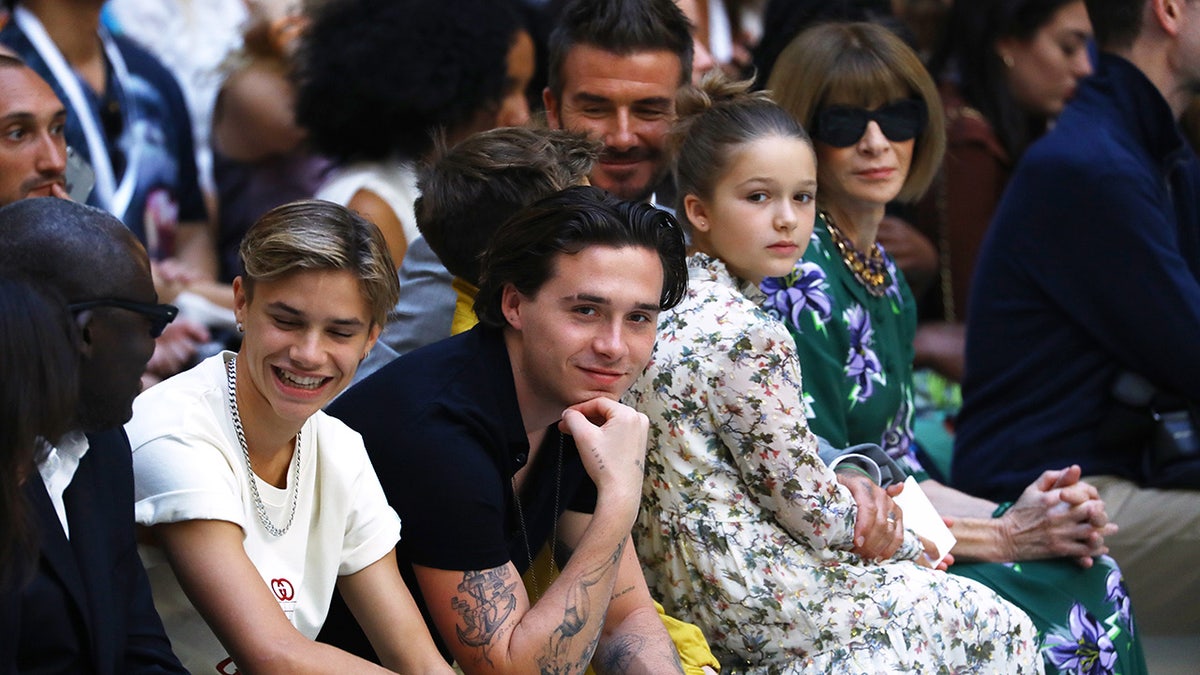 Victoria's Beckham's children watching her fashion show