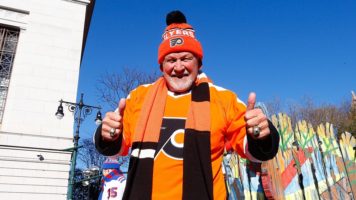 Bernie Parent poses on float