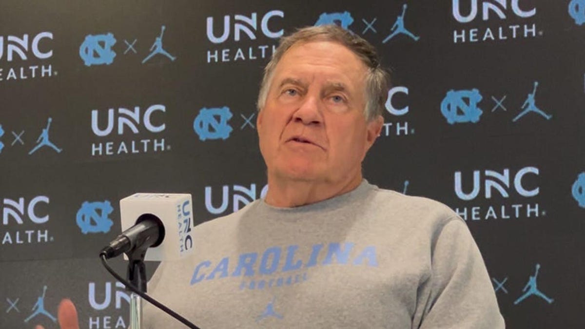 Bill Belichick looks out to reporters