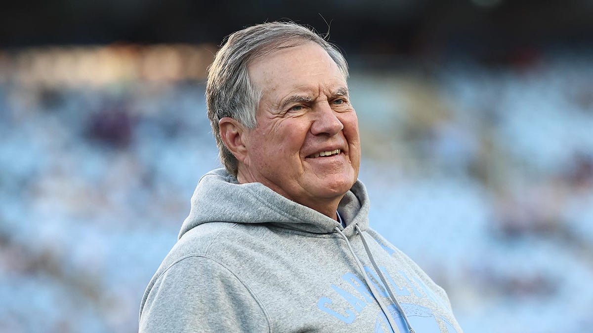Bill Pelicik smiles at Kennan Stadium
