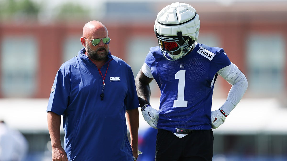 Brian Daboll and Malik Nabers talk at practice