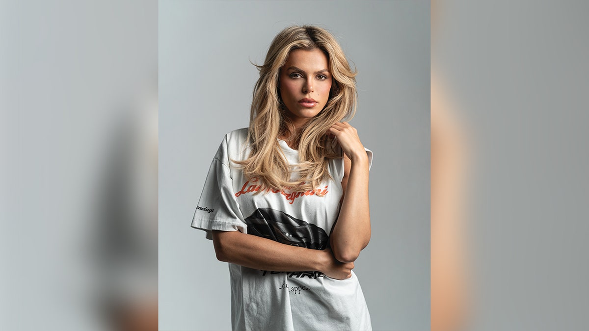 Brooks Nader wears a white T-shirt for Maxim magazine.