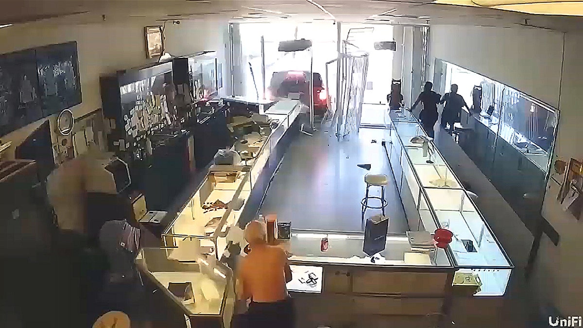 SUV backed into jewelry store