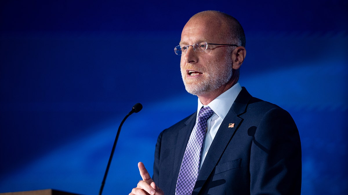 Brendan Carr delivers remarks at podium on public interest in broadcasting