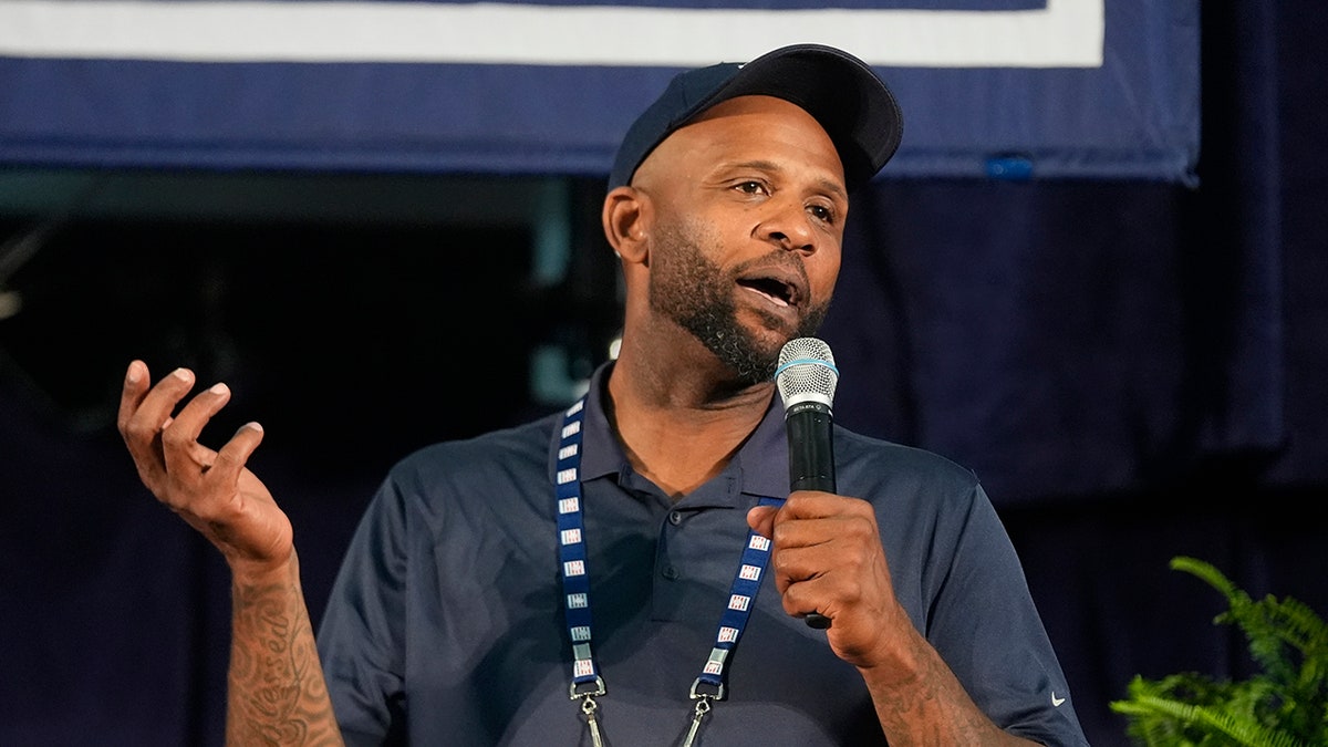 CC Sabathia speaks on a microphone
