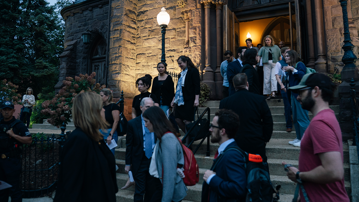 Mourning people leave Mass at DC