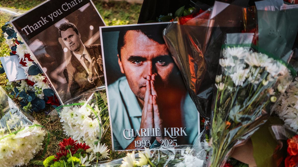 A view of flowers and photographs laid by mourners outside the U.S. Embassy in Pretoria