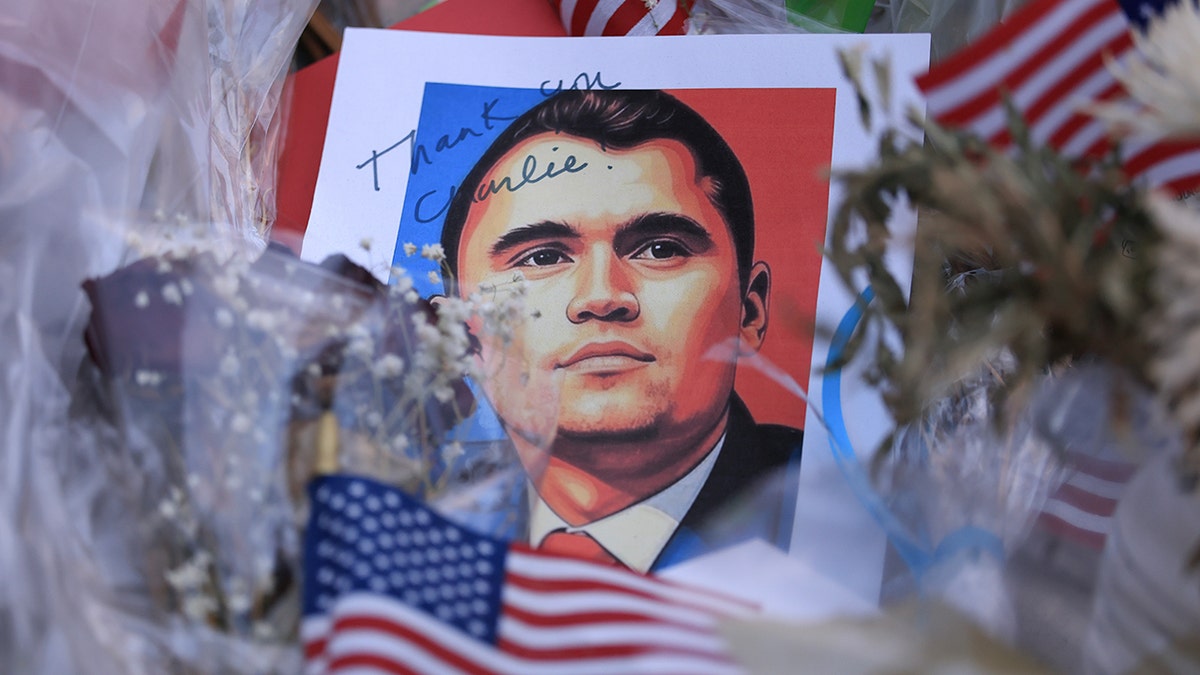 Charlie Kirk memorial portrait with American flags