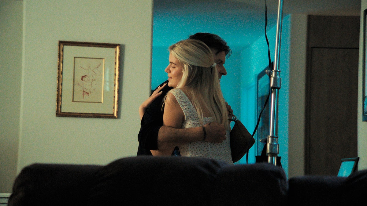 Charlie Sheen embracing his daughter Lola Sheen.