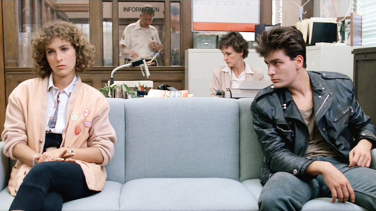 Jennifer Grey and Charlie Sheen acting out a scene from Ferris Bueller's Day Off.