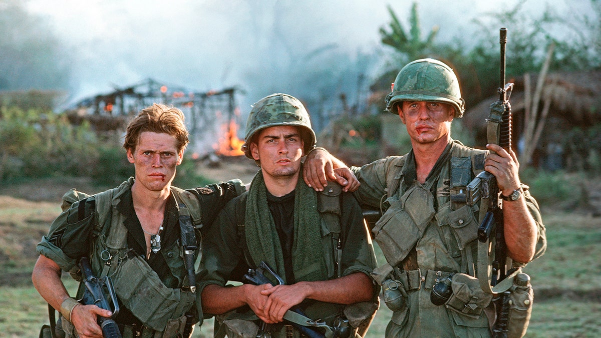 Charlie Sheen with his castmates in Platoon.